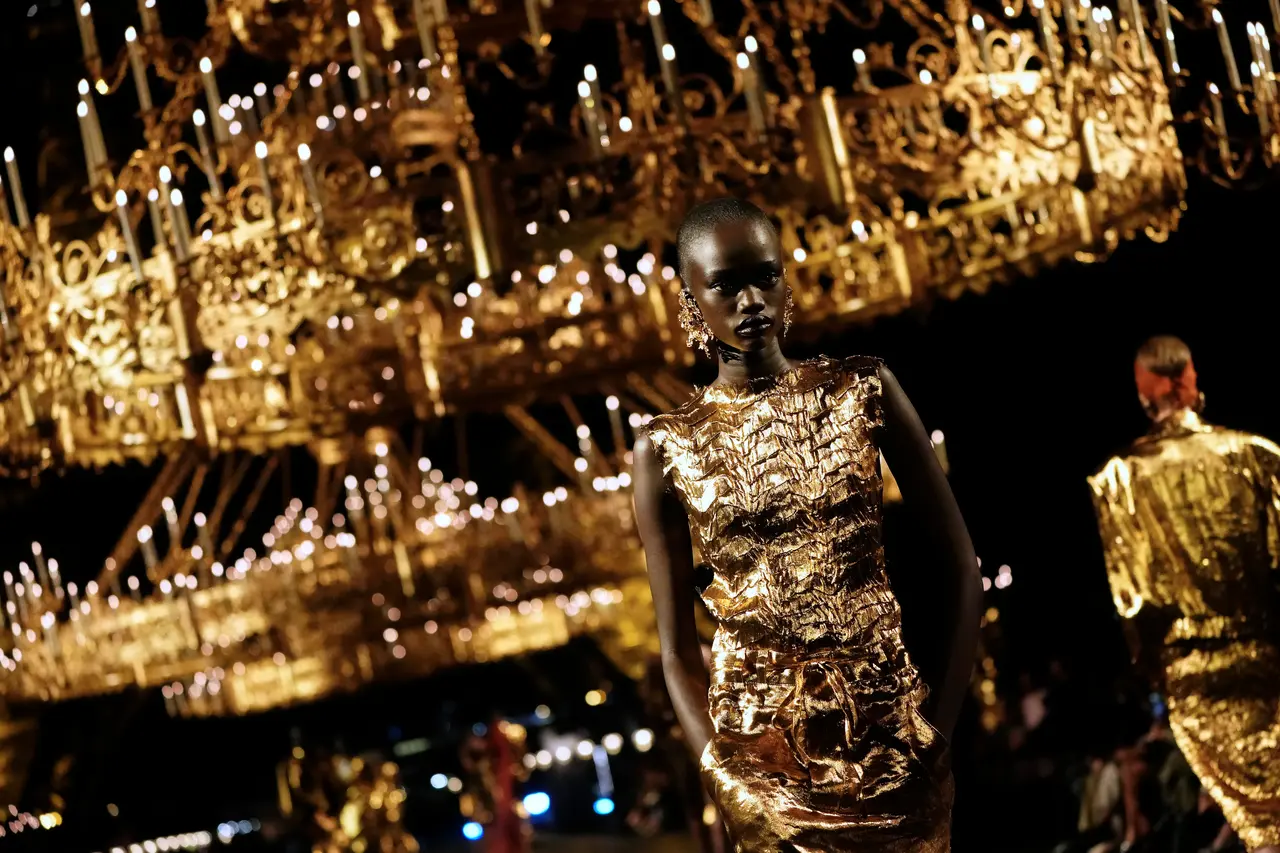 Paris fashion defies a bruised luxury industry with J.Lo, golden glamour and skimpy outfits