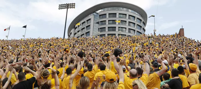 College football traditions: 'Hawkeye Wave' bonds everyone in stadium with kids in adjacent hospital