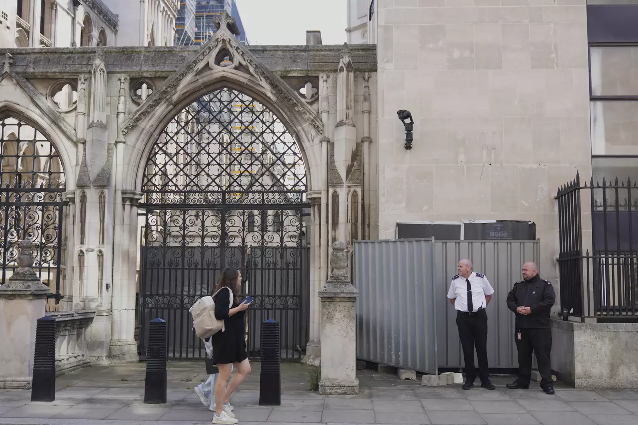 Banksy unveils a new mural of a judge beating a protester outside London court