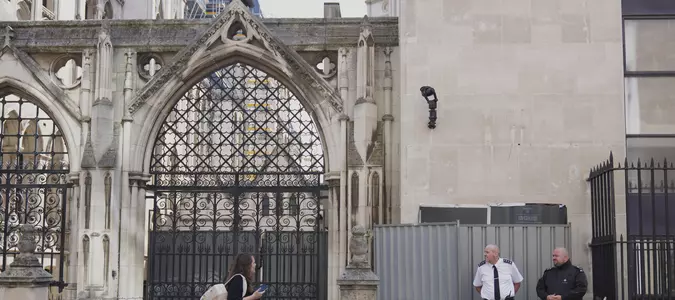 Banksy unveils a new mural of a judge beating a protester outside London court
