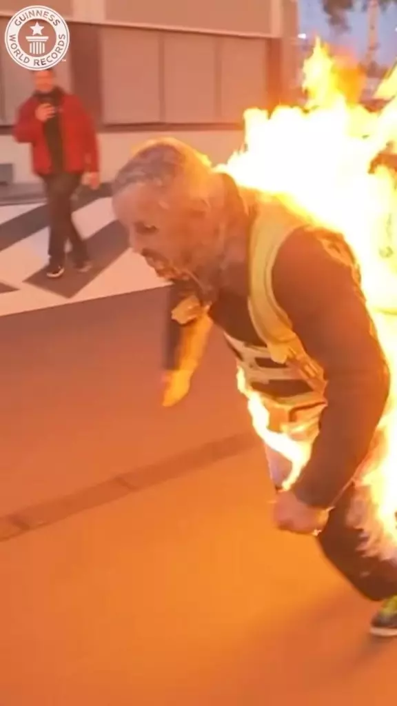 Stunt performer pulls a car while on fire to break world record