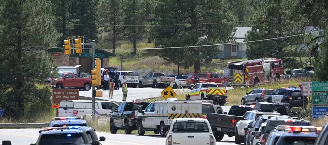 Authorities say student who had been radicalized fired revolver at Colorado school, wounding 2