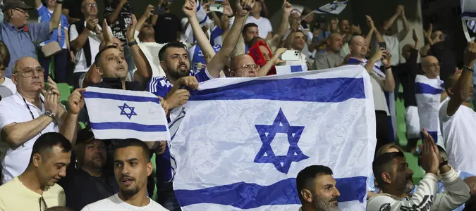 Israel soccer coach 'standing behind my country' amid calls for squad to be suspended