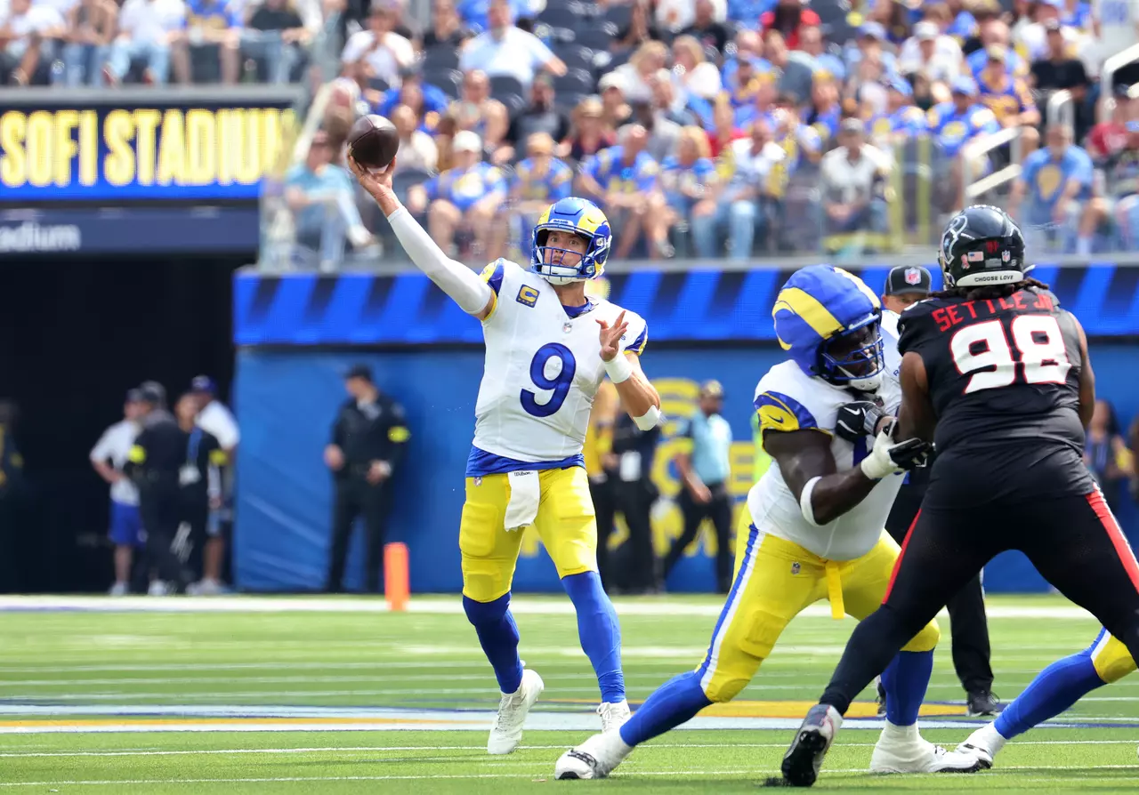 What bad back? Matthew Stafford helps lead Rams to season-opening win over Texans.