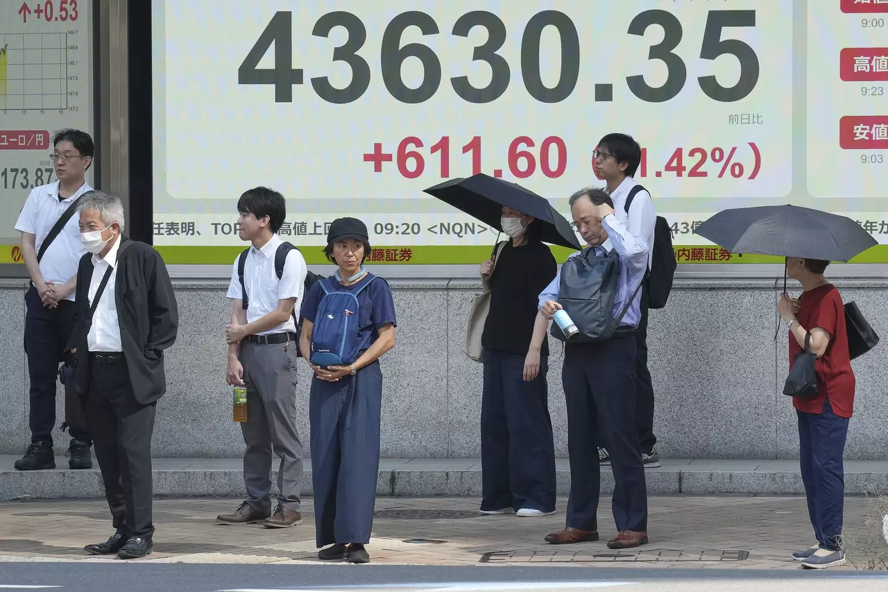 Asian shares rise after Japan's prime minister resigns