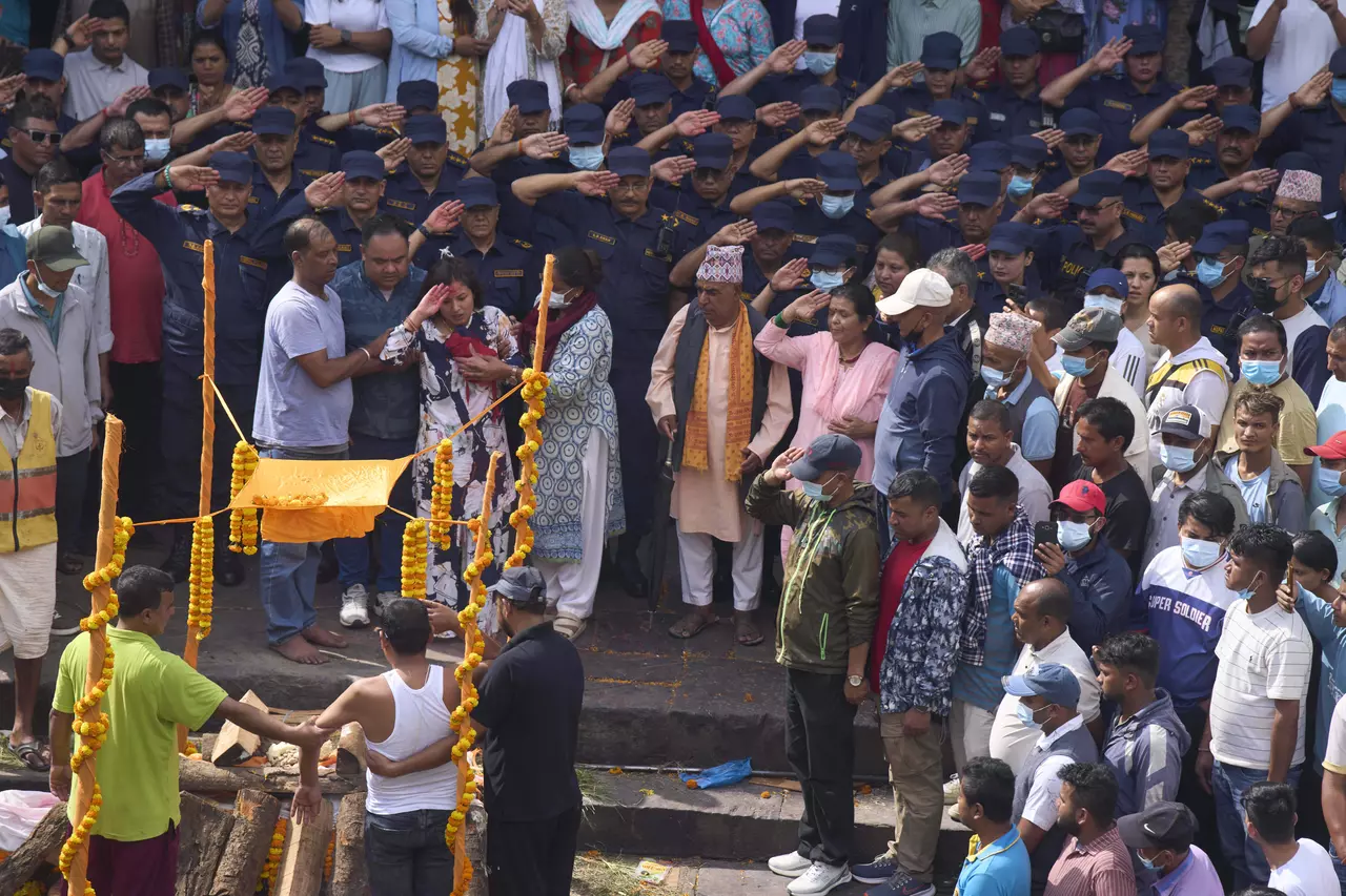 Nepal's president appoints former chief justice as interim premier and first woman leader