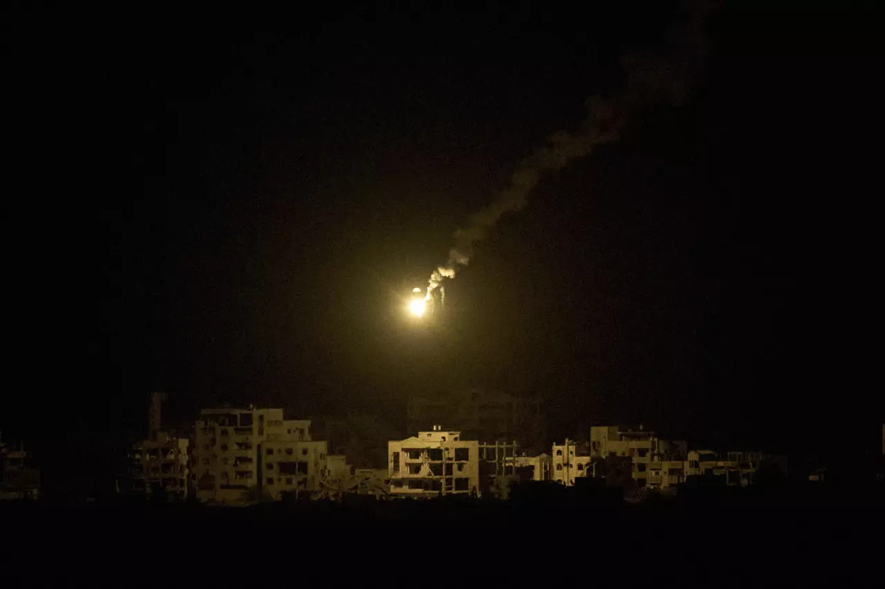 The Latest: Palestinians report heavy strikes as Israeli defense minister says 'Gaza is burning'