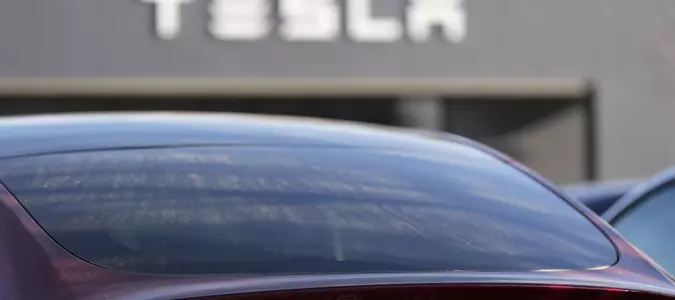 Tesla under investigation after parents say faulty door handles trapped their kids in the back