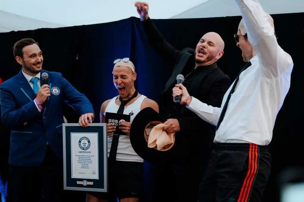 Pitbull fans don bald caps to break Guinness World Record in London