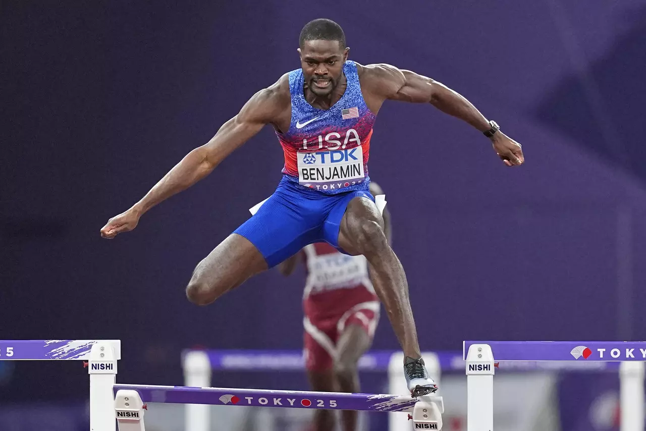 Benjamin wins 400 hurdles, is disqualified, then given worlds gold medal