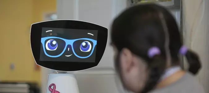 A robot programmed to act like a 7-year-old girl works to combat fear and loneliness in hospitals
