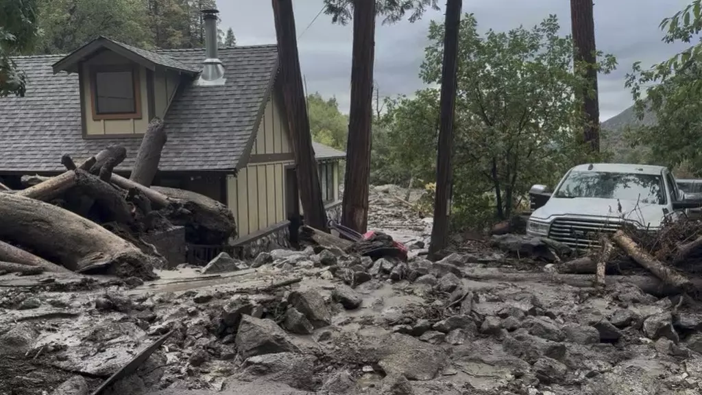 Mudslides trap drivers, bury roads and damage homes in southern California