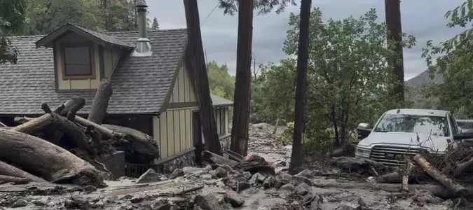 Mudslides trap drivers, bury roads and damage homes in southern California